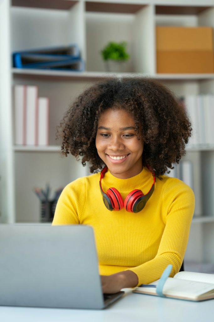 start-up business, young african woman american used laptop computer typing Search online for financ